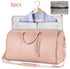 Light pink faux leather duffel bag with gold zippers, shown with detachable garment bag and mesh pouch.