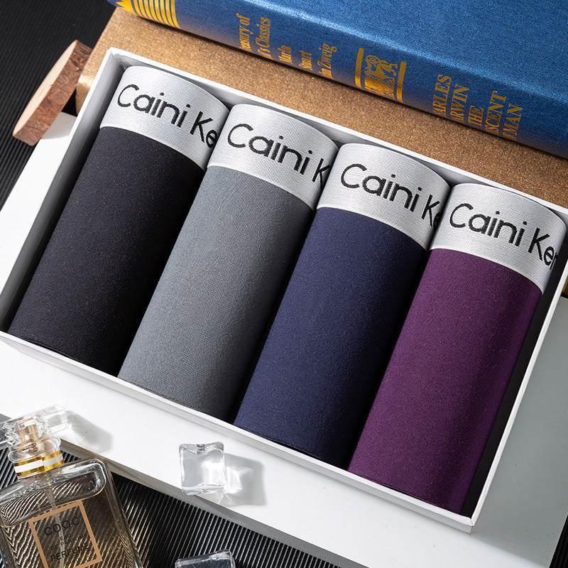 Set of four men's cotton boxer briefs in black, grey, navy, and purple with classic fit