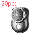 Compact black and silver electric shaver with circular blade design, modern tech accessory