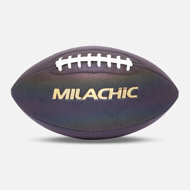 Iridescent dark purple textured football with white laces and metallic gold lettering, studio background