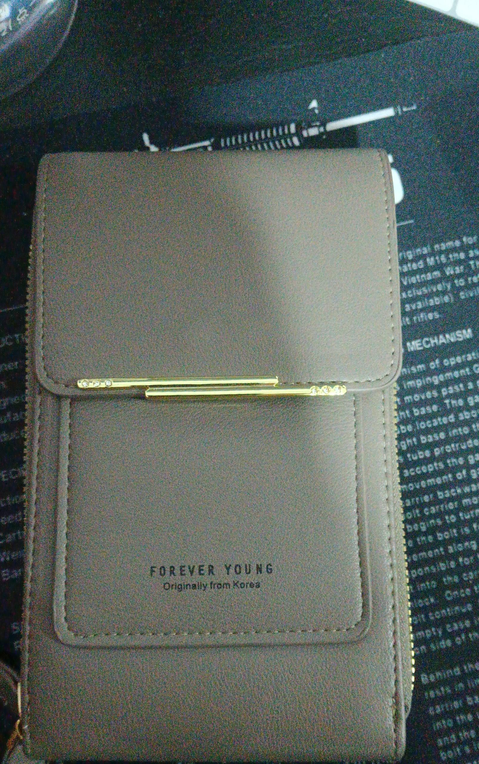 Taupe faux leather crossbody bag with gold hardware, slim fit, minimalist design