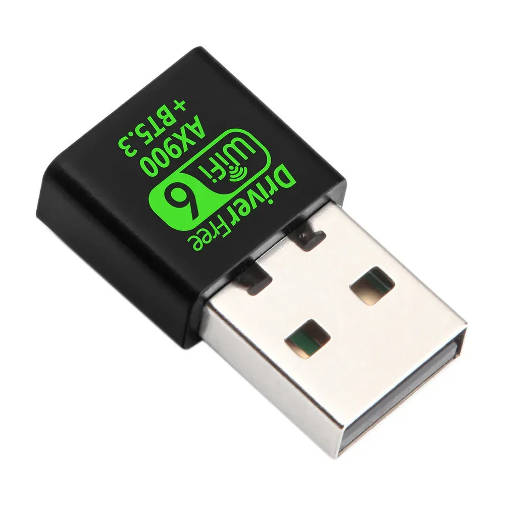 Compact USB WiFi 6 adapter in black with green text, metal connector visible.