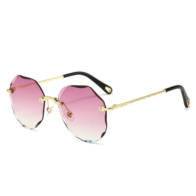 Rimless sunglasses with scalloped pink gradient lenses, gold metal arms, and black temple tips