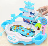 Colorful plastic fishing game set with blue and white ocean theme, toy fish, and water being poured in