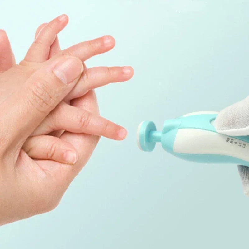 Electric baby nail trimmer in use on child's fingernails, soft pastel blue color, gentle care
