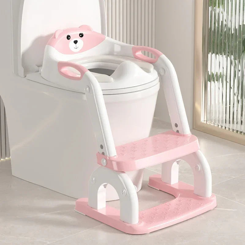 Pink and white toddler toilet training seat with steps and bear design, plastic material, fits most toilets.