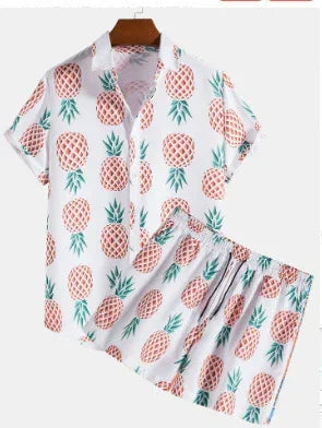 White short-sleeve shirt and shorts set with orange pineapple print, relaxed fit, lightweight material.