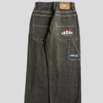 Wide-leg black denim jeans with large back pockets, contrast stitching, and colorful patches.