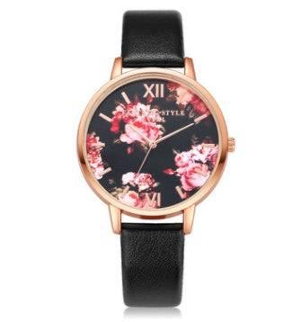 Rose gold watch with black leather band and floral print dial, modern streetwear accessory