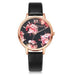 Rose gold watch with black leather band and floral print dial, modern streetwear accessory