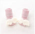 Soft pink ribbed baby socks with white plush angel wings, cozy and cute style for infants