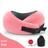Pink plush travel neck pillow with black buckle strap and mesh detail, drawstring pouch included.
