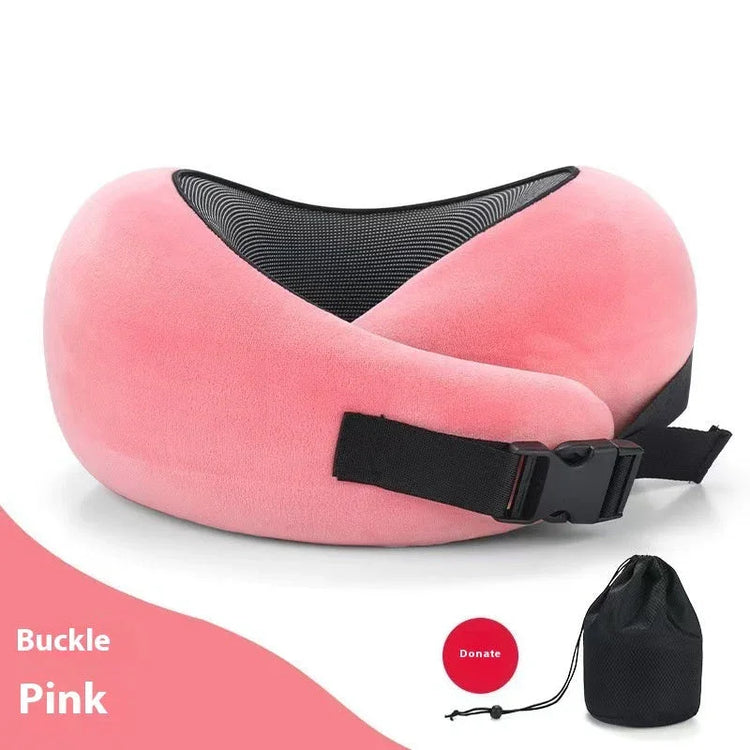 Pink plush travel neck pillow with black buckle strap and mesh detail, drawstring pouch included.
