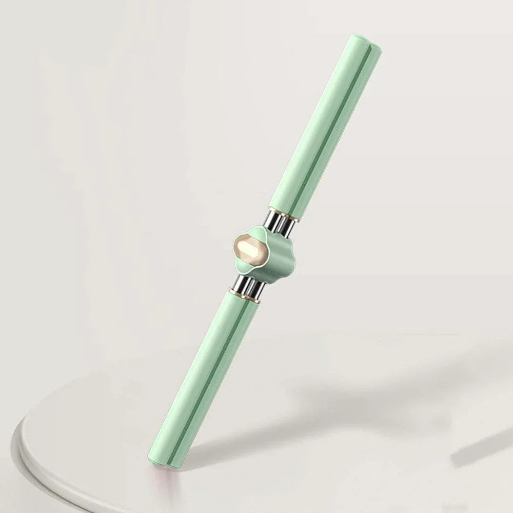 Mint green double-ended pen with a shiny gold rotating center on a minimalist surface