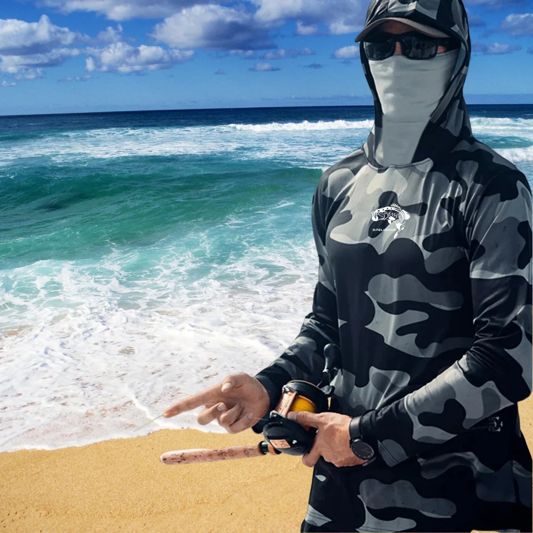 Man wearing black and grey camo hooded long sleeve fishing shirt on the beach