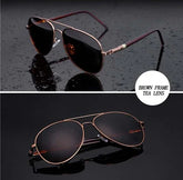 Aviator sunglasses with brown metal frame and dark tea-tinted lenses on black background