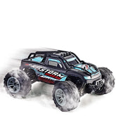 Off-road RC truck with large tires, black and blue body, and rugged details drifting on white