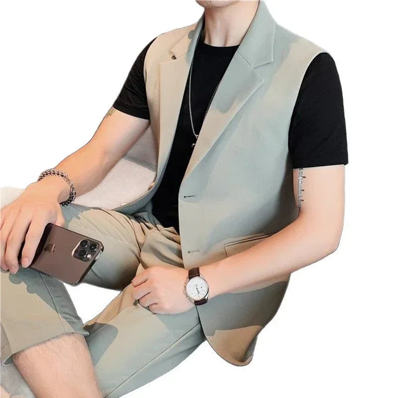 Man in light beige sleeveless blazer and pants set with black t-shirt, modern slim fit style