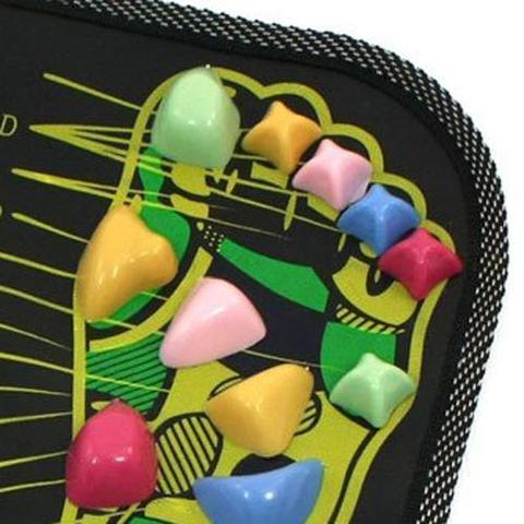 Close-up of a colorful acupressure foot mat with raised resin massage nodes