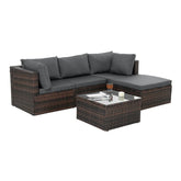 Brown rattan outdoor sectional sofa with dark gray cushions and matching glass top coffee table