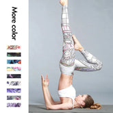 Woman wearing high-waisted patterned yoga leggings and white sports bra performing a yoga pose
