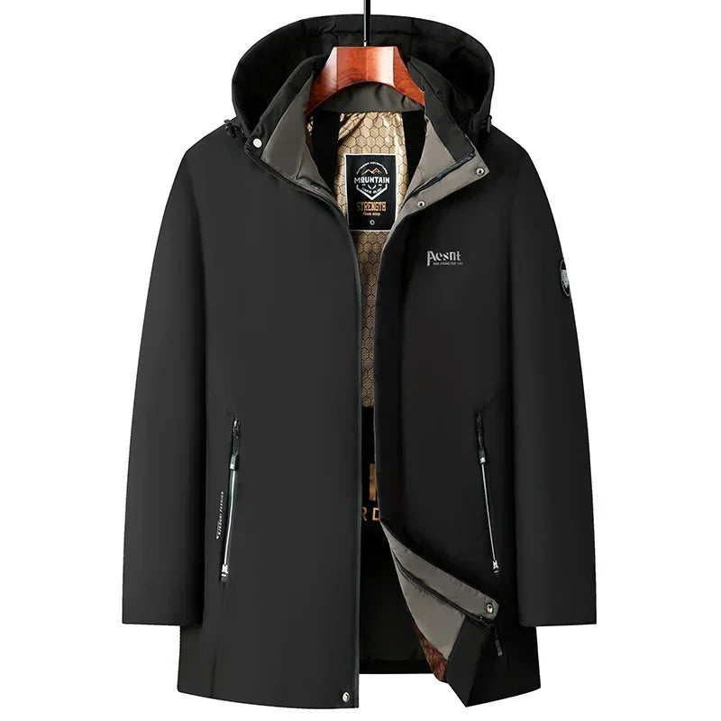Black hooded streetwear jacket with zipper pockets, waterproof material, and relaxed fit.