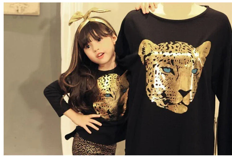 Black long-sleeve shirts with gold leopard face print, relaxed fit, matching child and adult