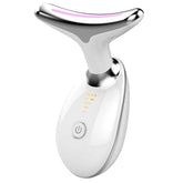 White handheld facial massager with metallic Y-shaped head and digital controls