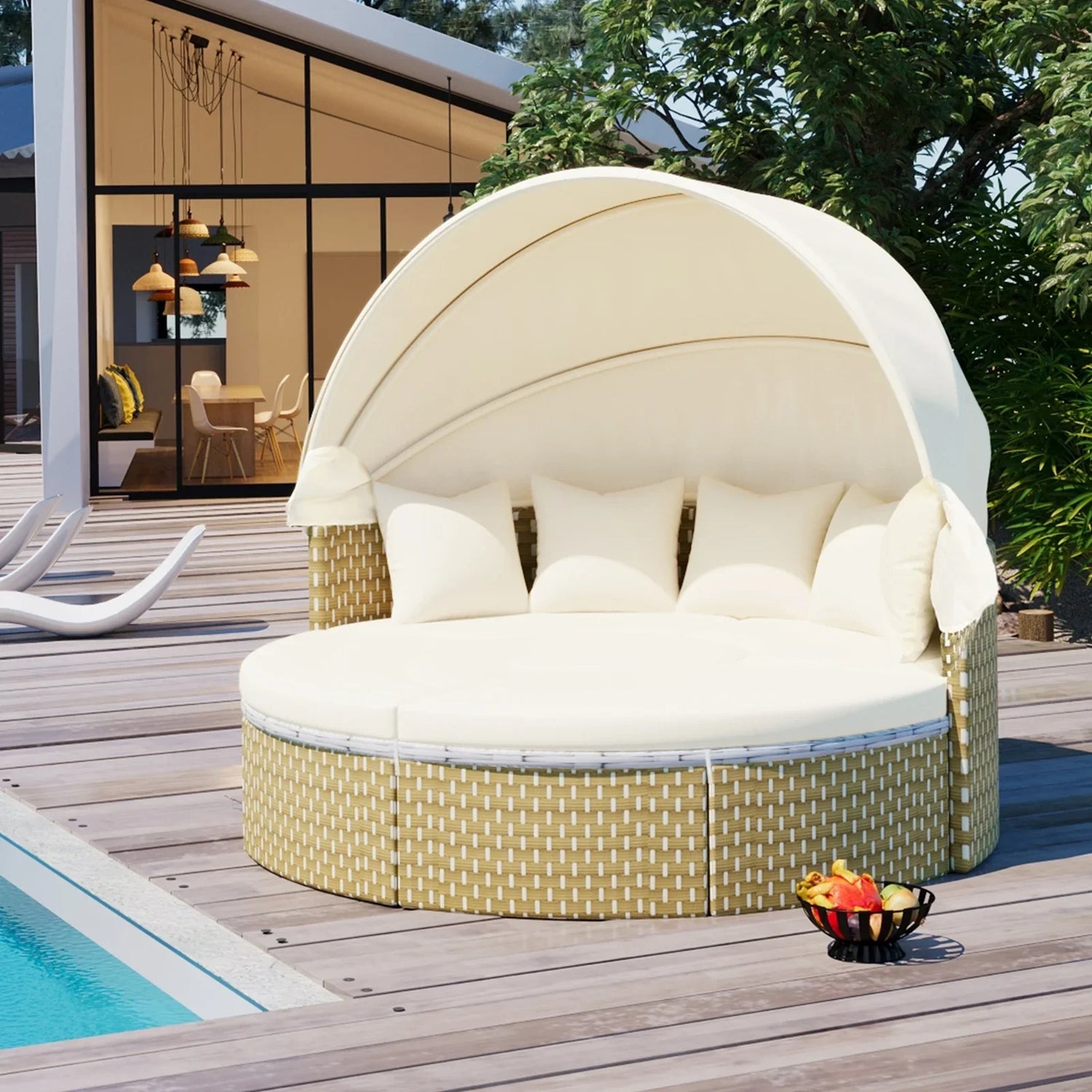 Beige round outdoor daybed with canopy, wicker base, and white cushions by a poolside