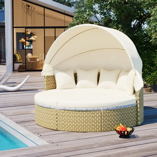 Beige round outdoor daybed with canopy, wicker base, and white cushions by a poolside