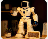 White and blue plastic humanoid robot toy with remote control on a desk setting