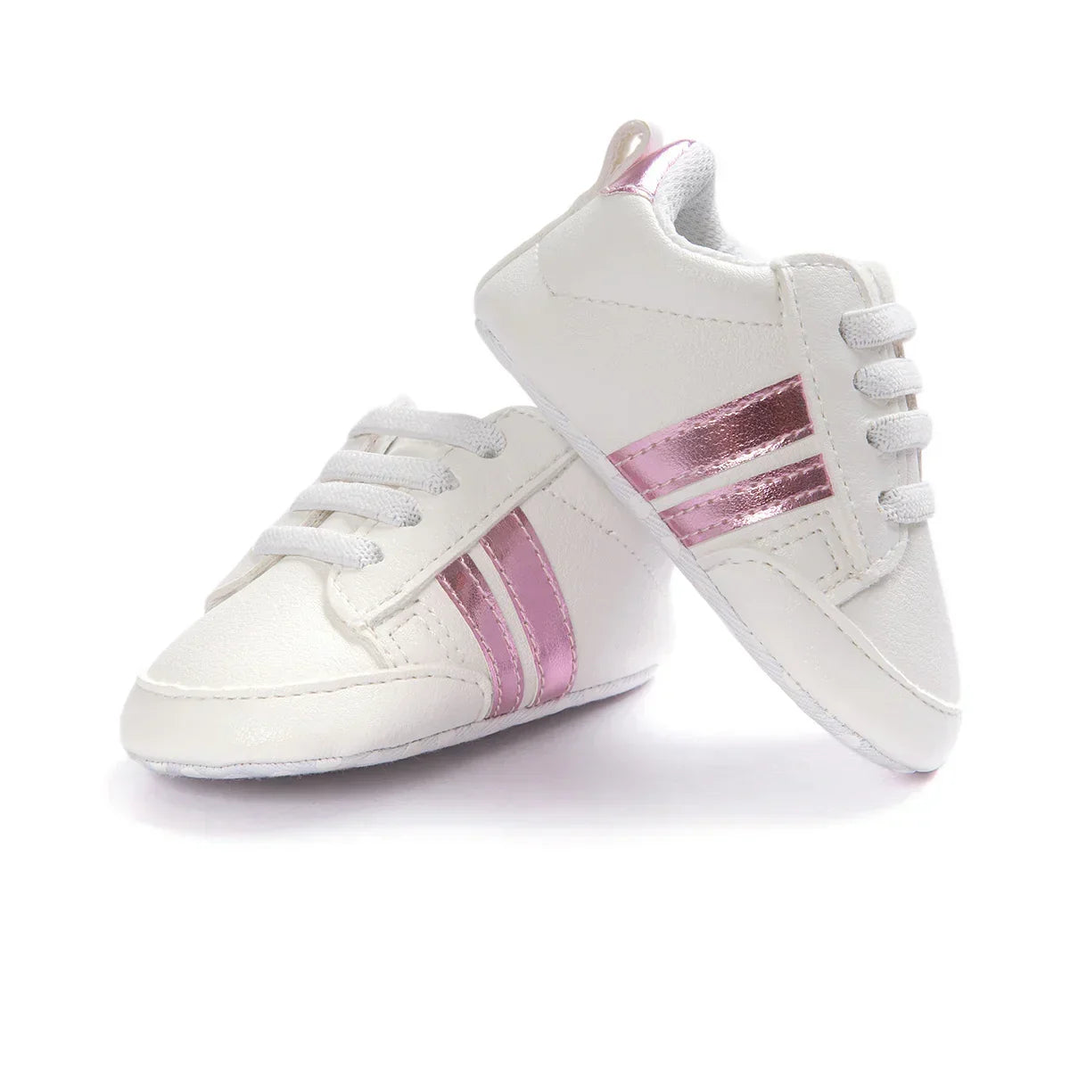 White baby sneakers with shiny pink stripes, faux leather, lace-up, modern streetwear style