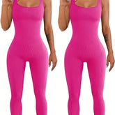 Women wearing bright pink ribbed sleeveless jumpsuits with a slim, bodycon fit