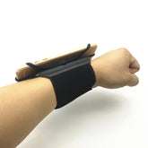 Black adjustable wristband with phone holder, elastic material, snug fit on wrist