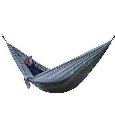 Lightweight gray nylon hammock with relaxed fit, person lying inside, suitable for outdoor use