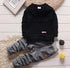 Black long sleeve sweatshirt with grey jogger pants, casual fit, soft fabric