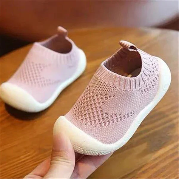 Pink knitted breathable slip-on sneakers with white soles, soft flexible fit