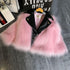Pink faux fur and black faux leather jacket with oversized fit on a hanger