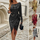 Woman wearing shiny long sleeve wrap dress with side tie in black, gold, red, and silver options