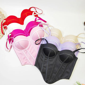 Assorted satin corset tops in black, red, white, pink, and beige with structured fit