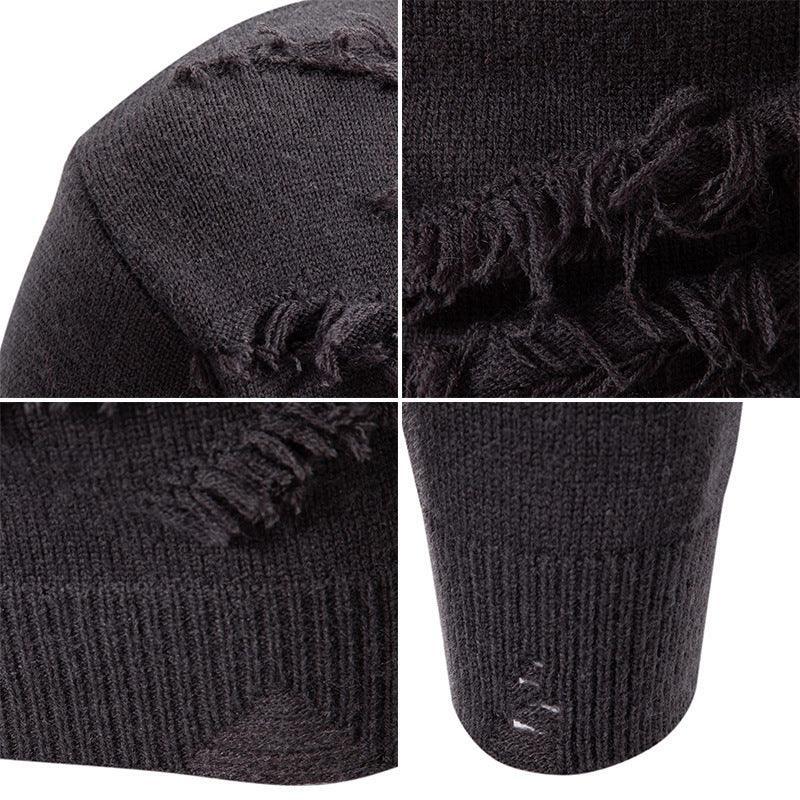 Close-up of black distressed knit sweater with frayed edges and ripped details