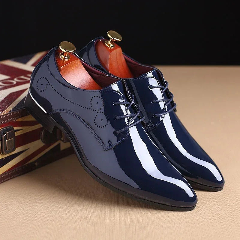 Men's glossy navy blue patent leather dress shoes with lace-up closure and sleek fit
