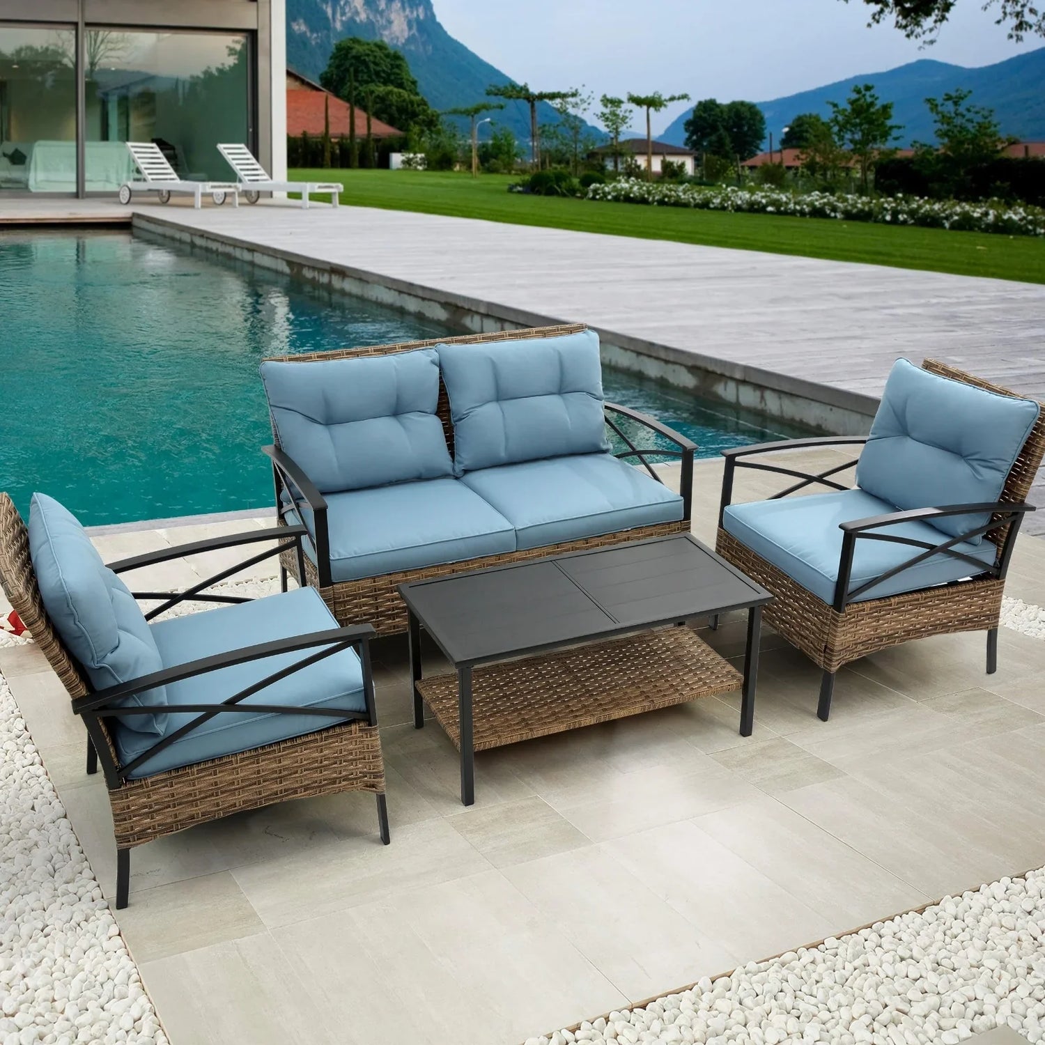 Outdoor patio set with light blue cushions, wicker frame, and black metal arms by a pool