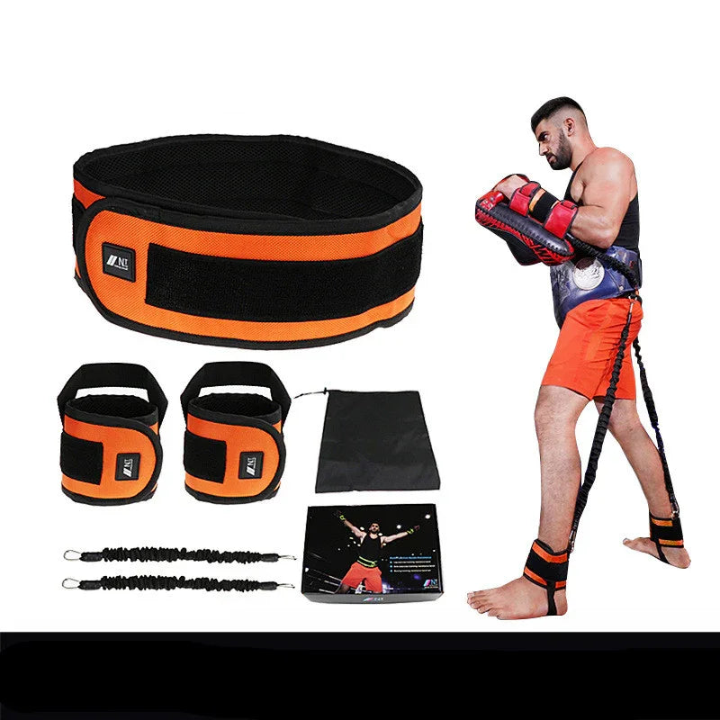 Man wearing orange and black resistance training bands, athletic shorts, and workout gear set.