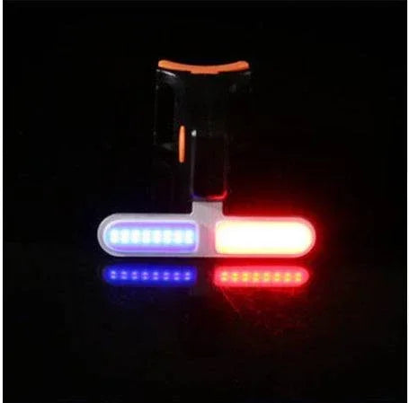 LED safety clip with blue and red lights, compact design, suitable for night visibility