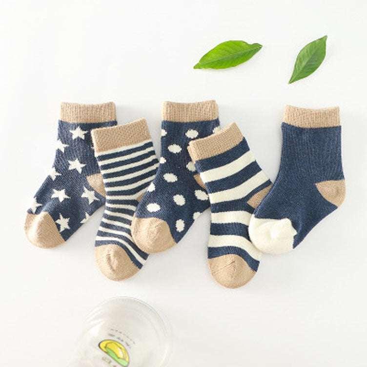Set of five navy blue and beige cotton socks in stars, stripes, and polka dot patterns