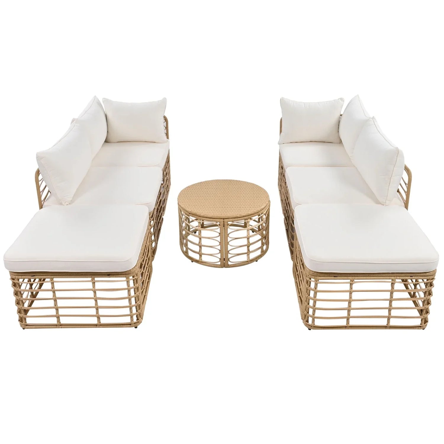 Beige rattan outdoor lounge set with white cushions and round wicker coffee table