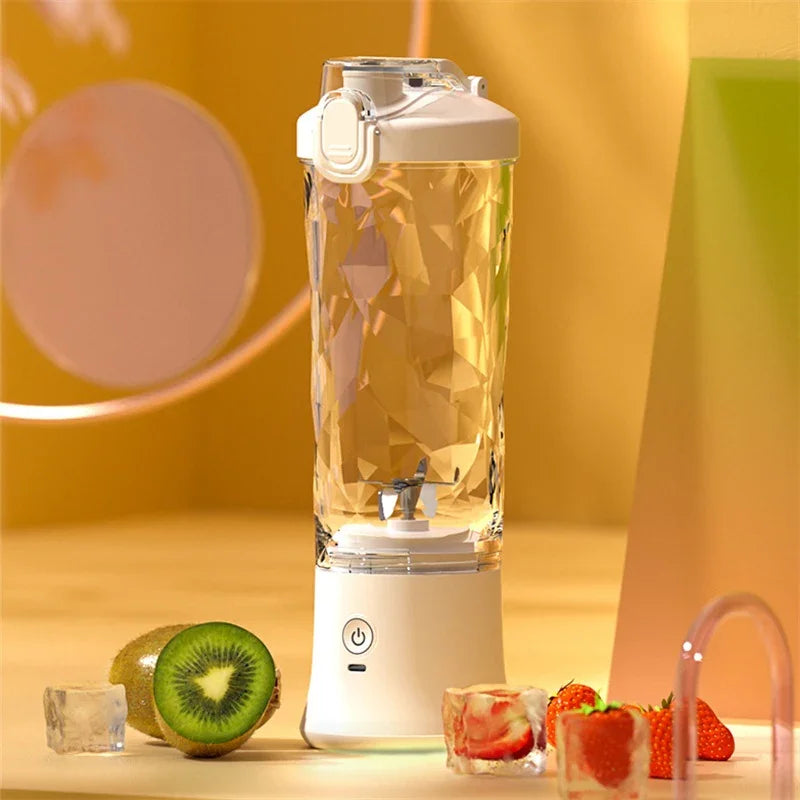 Portable crystal-patterned blender with white base, fruit and ice cubes on yellow background