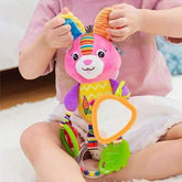 Child wearing relaxed light pink cotton T-shirt and white shorts, seated on carpet.