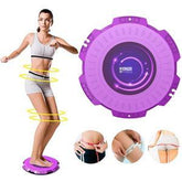 Woman wearing light gray sporty shorts and crop top using a purple balance board